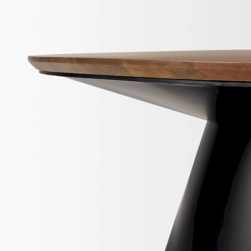 Table basse ronde Mitchell en bois massif avec piétement en fonte noire