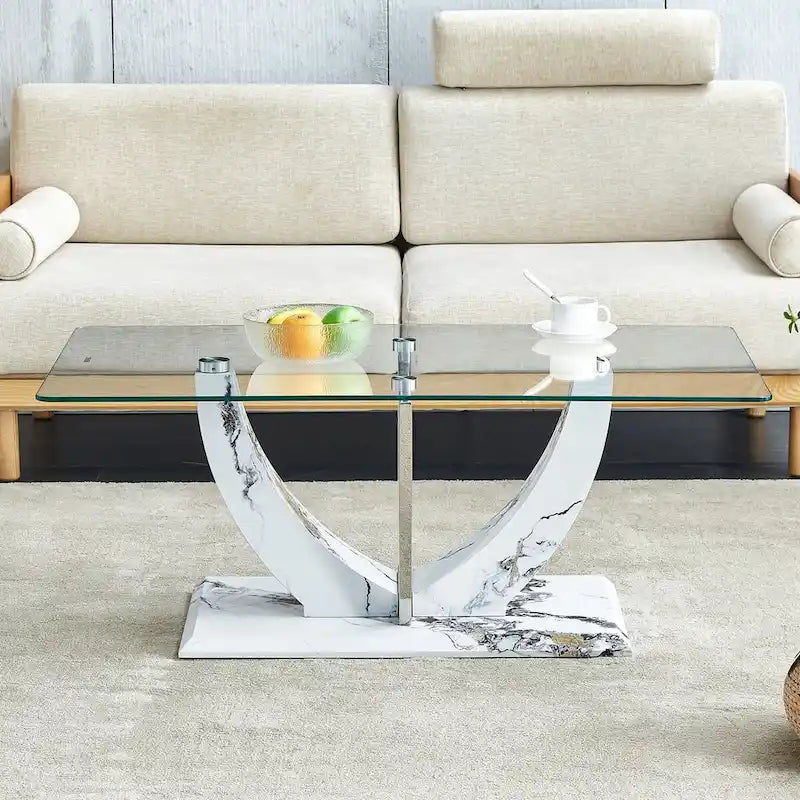 Table basse moderne minimaliste en verre trempé transparent avec pieds en MDF à motif marbre et colonnes décoratives en acier inoxydable